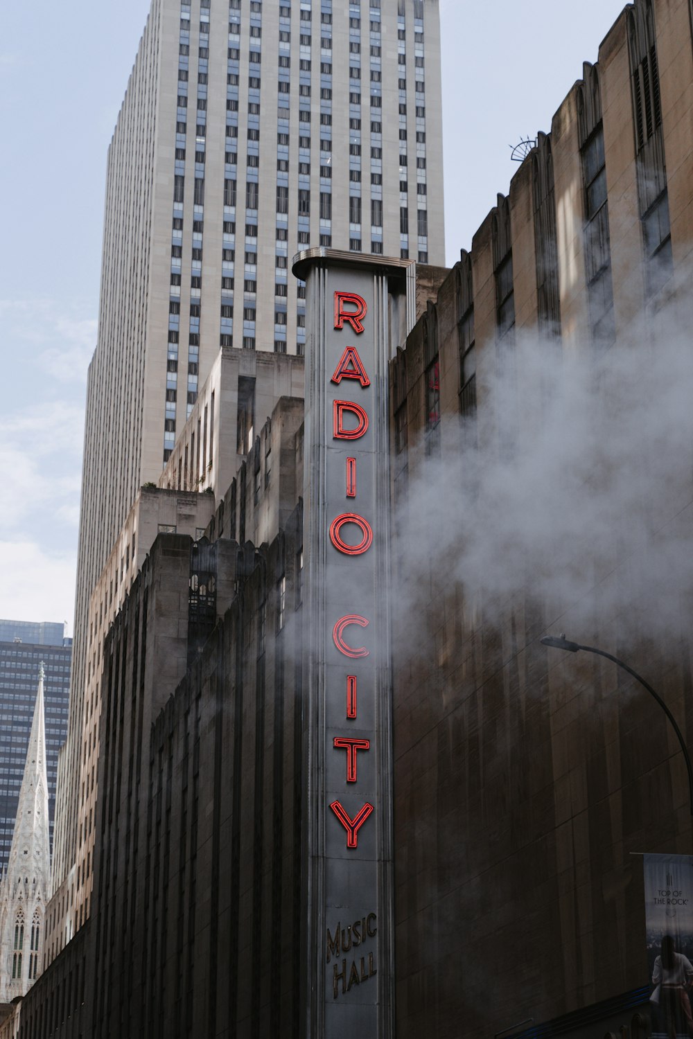 the radio city sign is lit up with steam