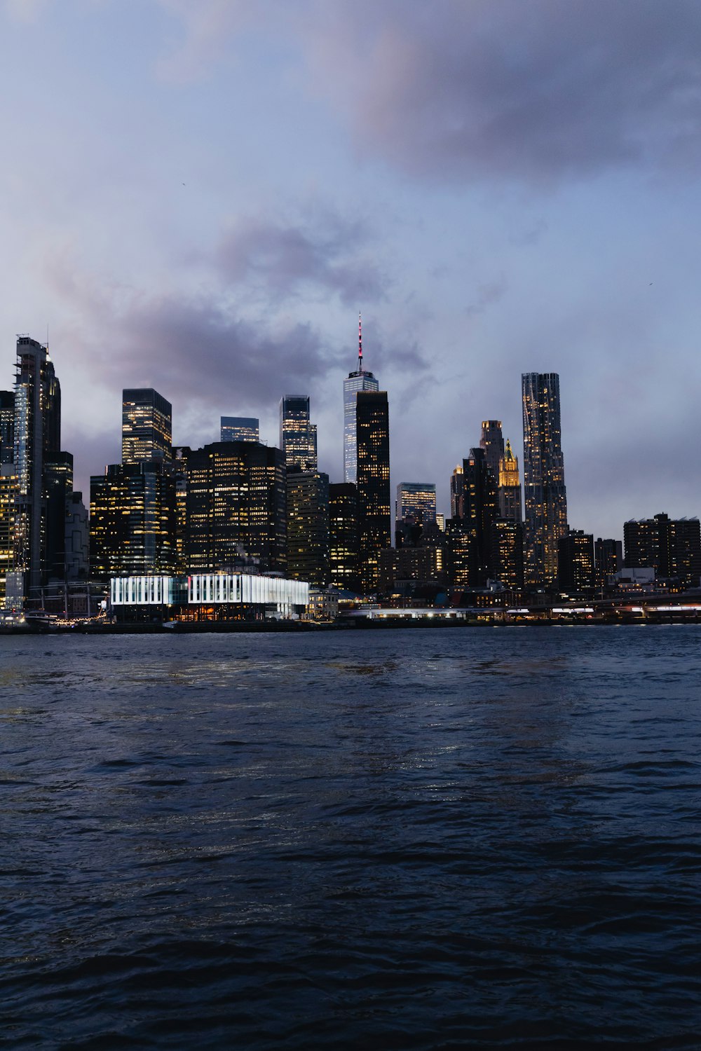 a view of a city at night from the water