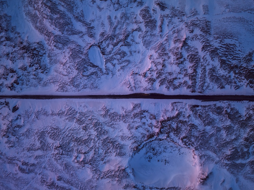 an aerial view of a snow covered mountain