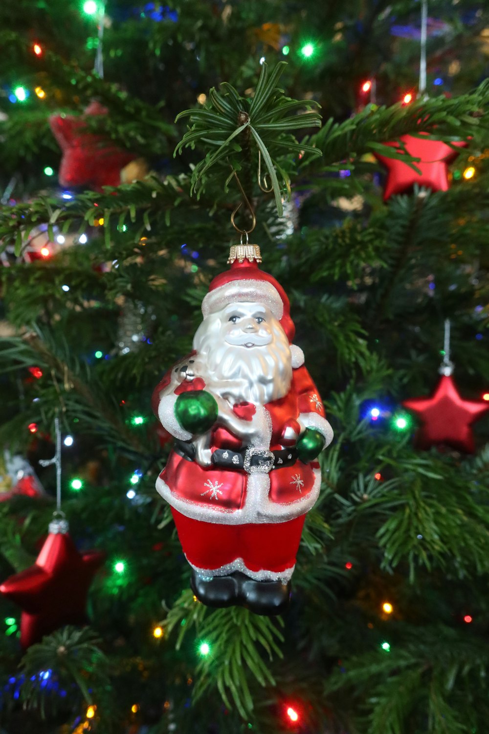 a christmas ornament hanging from a christmas tree