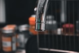 A close-up of a newly installed kitchen faucet.