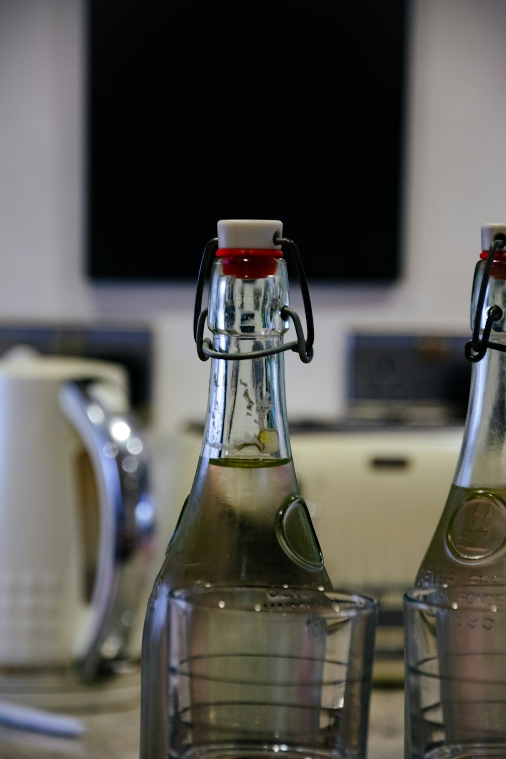 a couple of bottles of soda sitting on top of a table