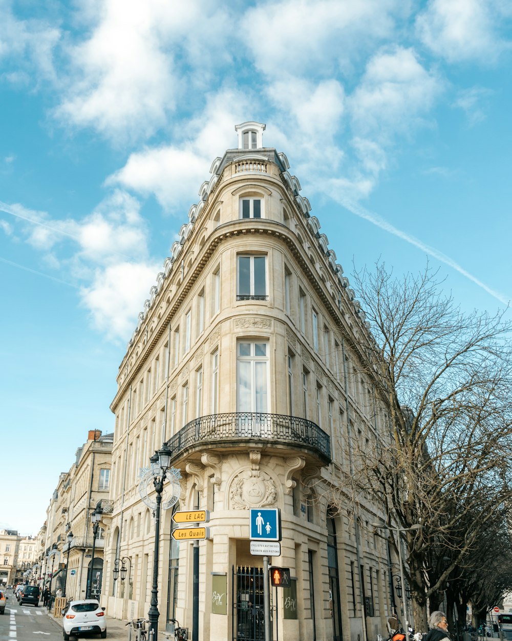 a tall building with a blue sign on the front of it