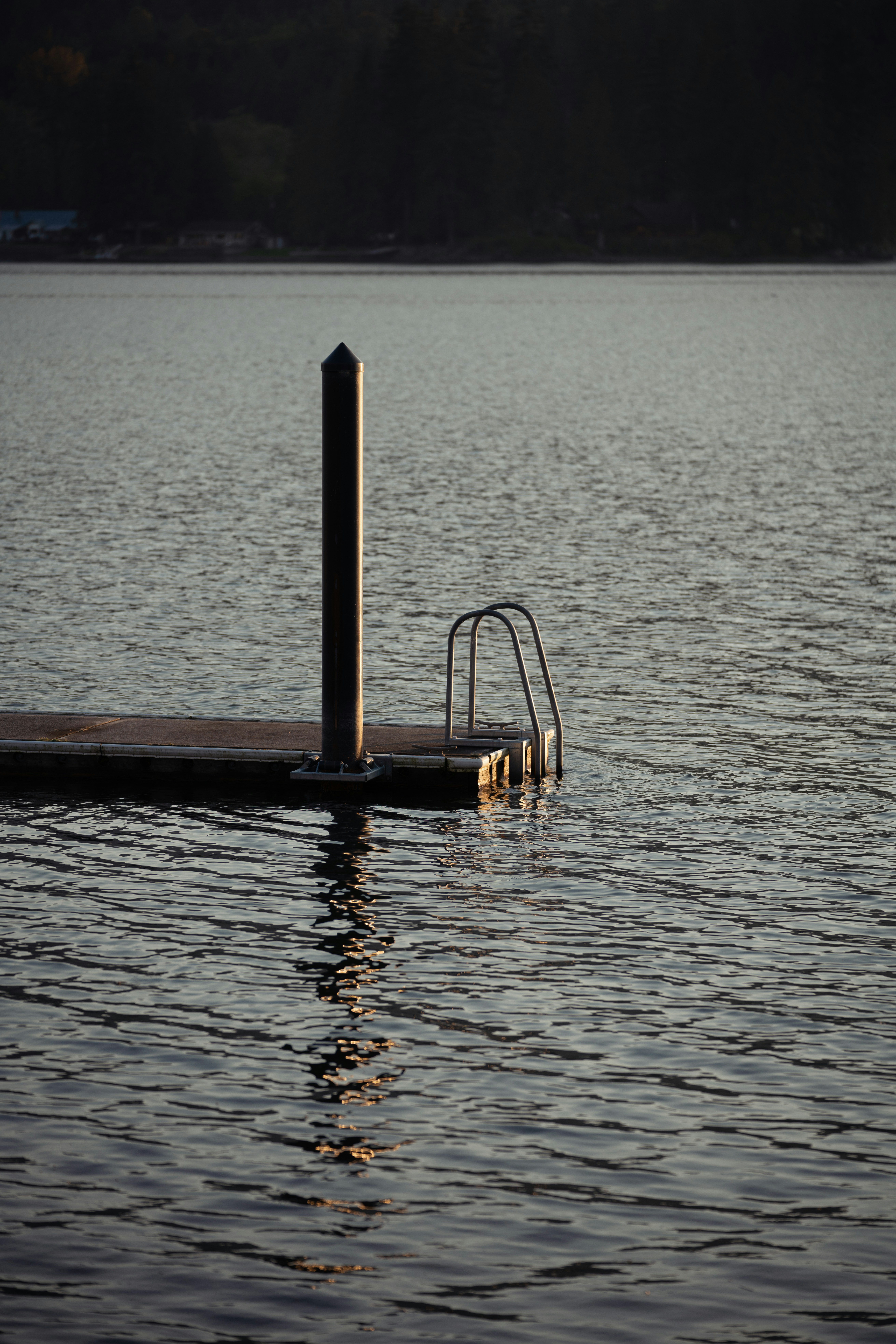 a boat dock in the middle of a body of water