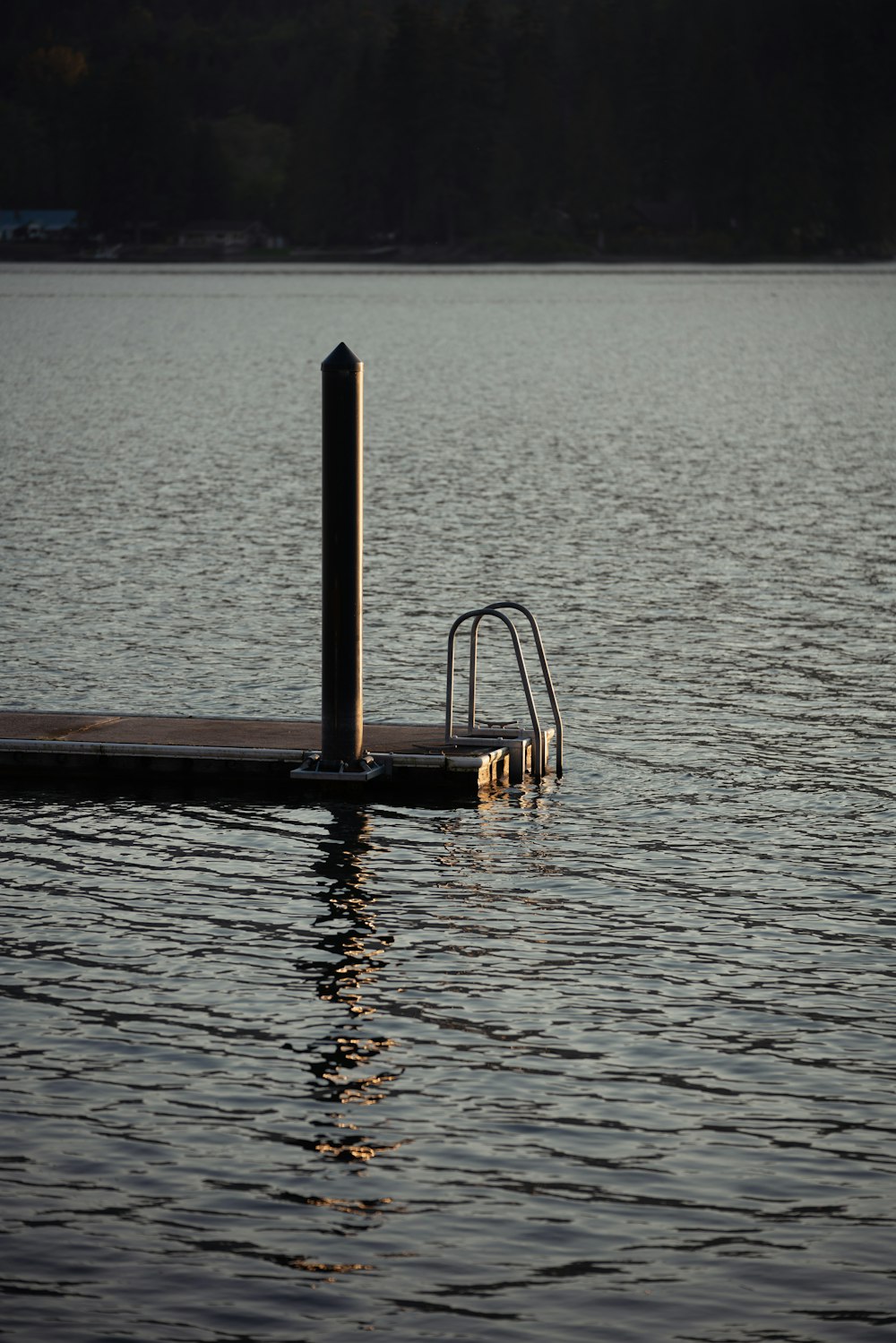 a boat dock in the middle of a body of water