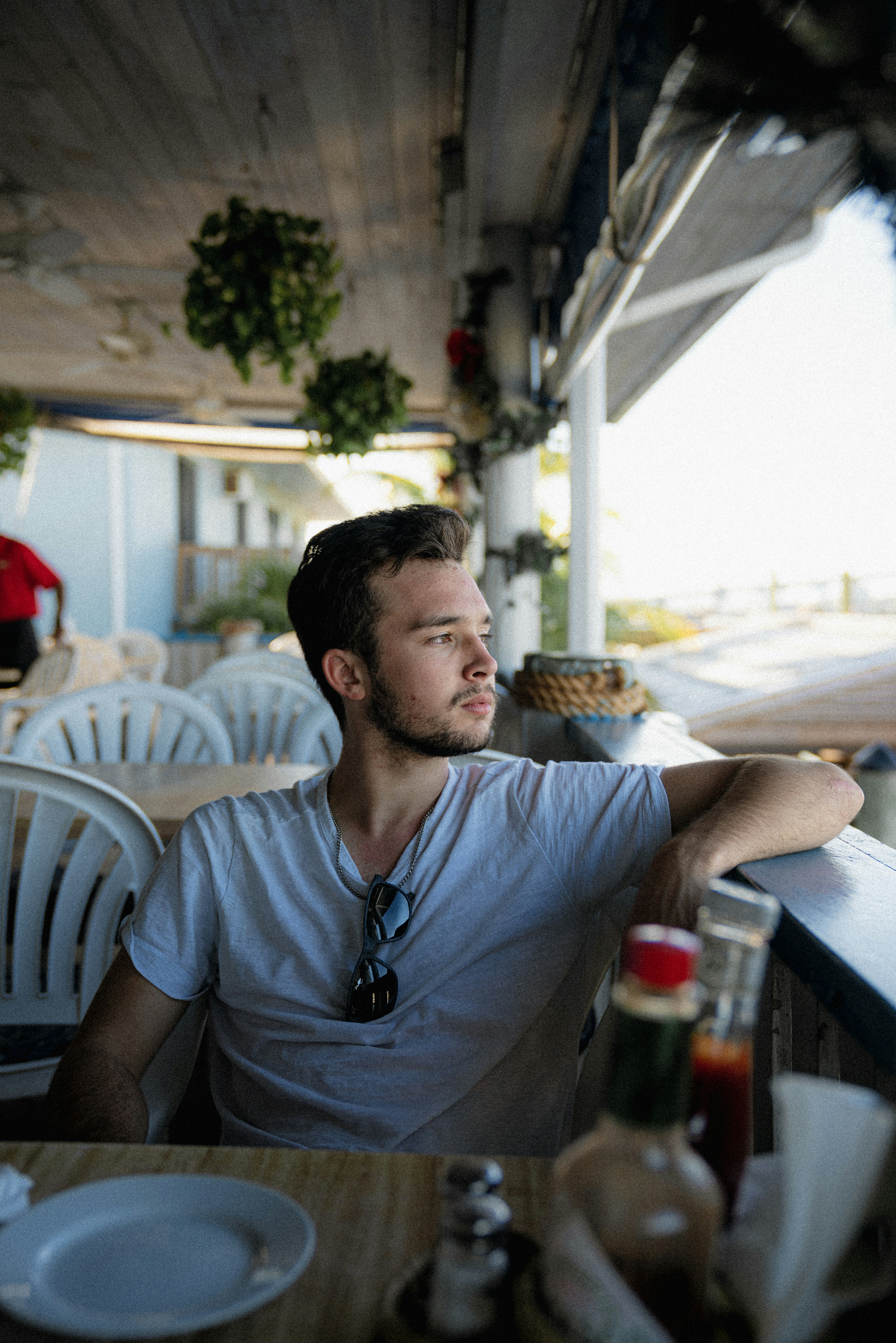 a man sitting at a table in a restaurant