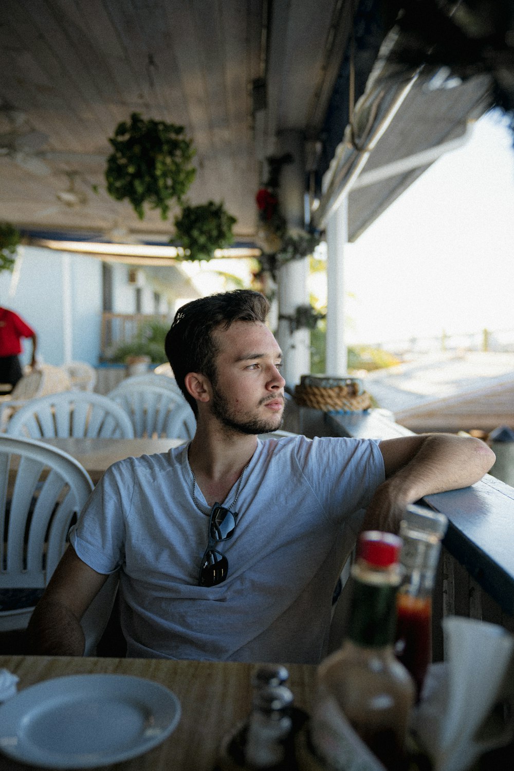 a man sitting at a table in a restaurant