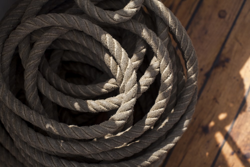 a close up of a rope on a wooden floor