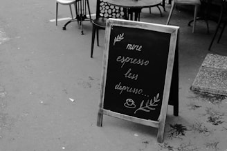 a black and white photo of a menu sign