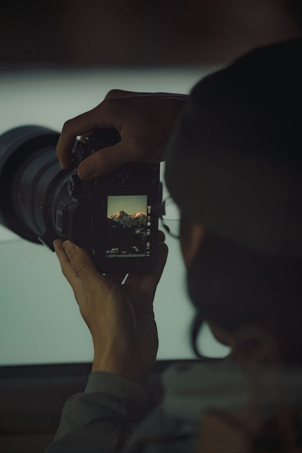 a person taking a picture with a camera