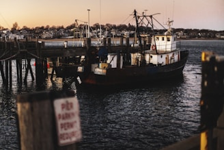 a large boat is docked at a pier