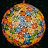 A spherical lampshade composed of intricate floral patterns in vibrant colors, with a mosaic of red, orange, blue, green, and yellow elements. The design allows light to diffuse through the gaps, creating a warm and colorful glow.