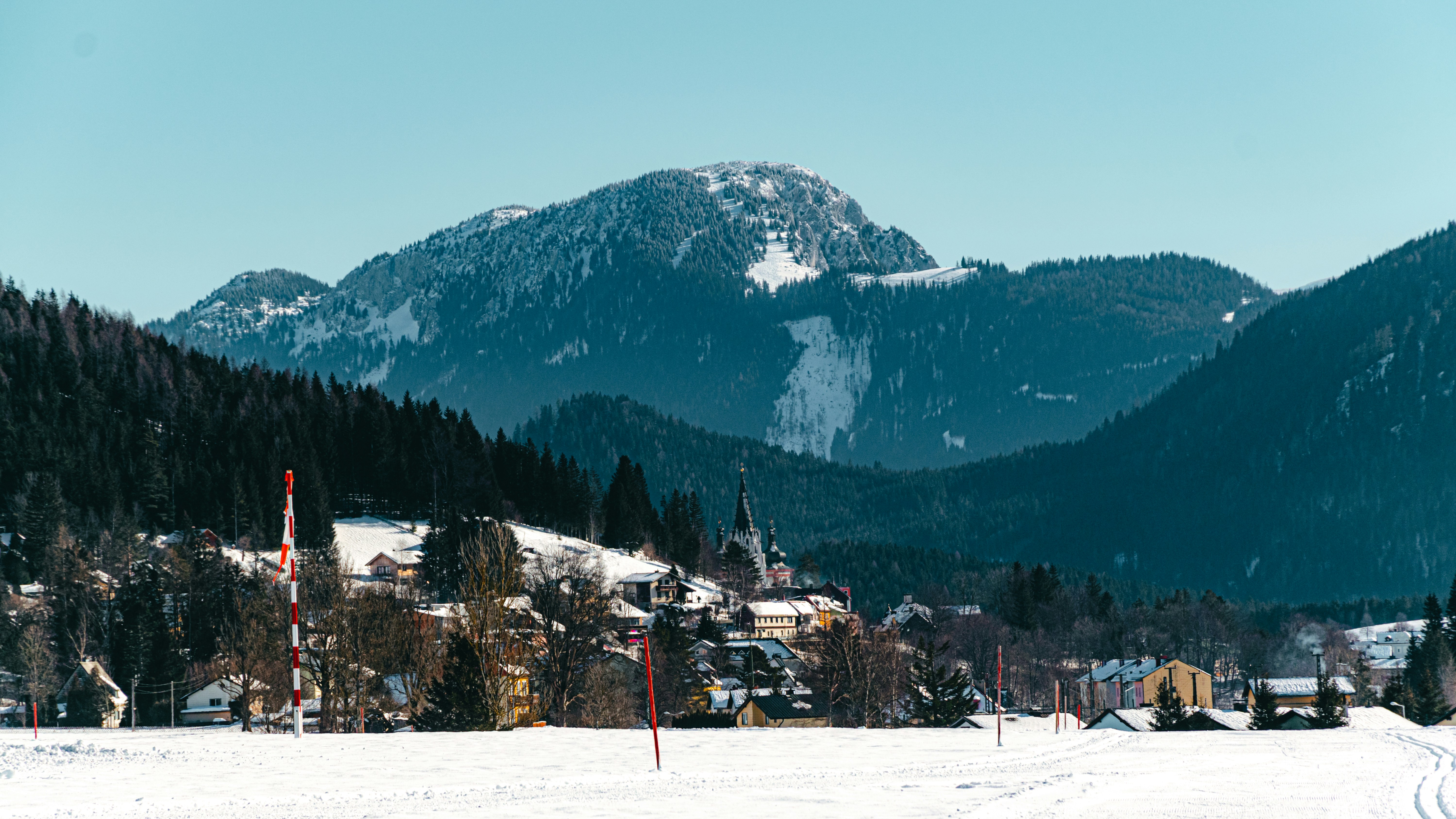 a ski resort with a mountain in the background