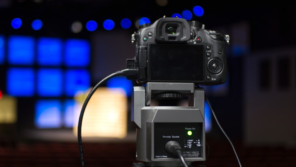 a video camera sitting on top of a tripod