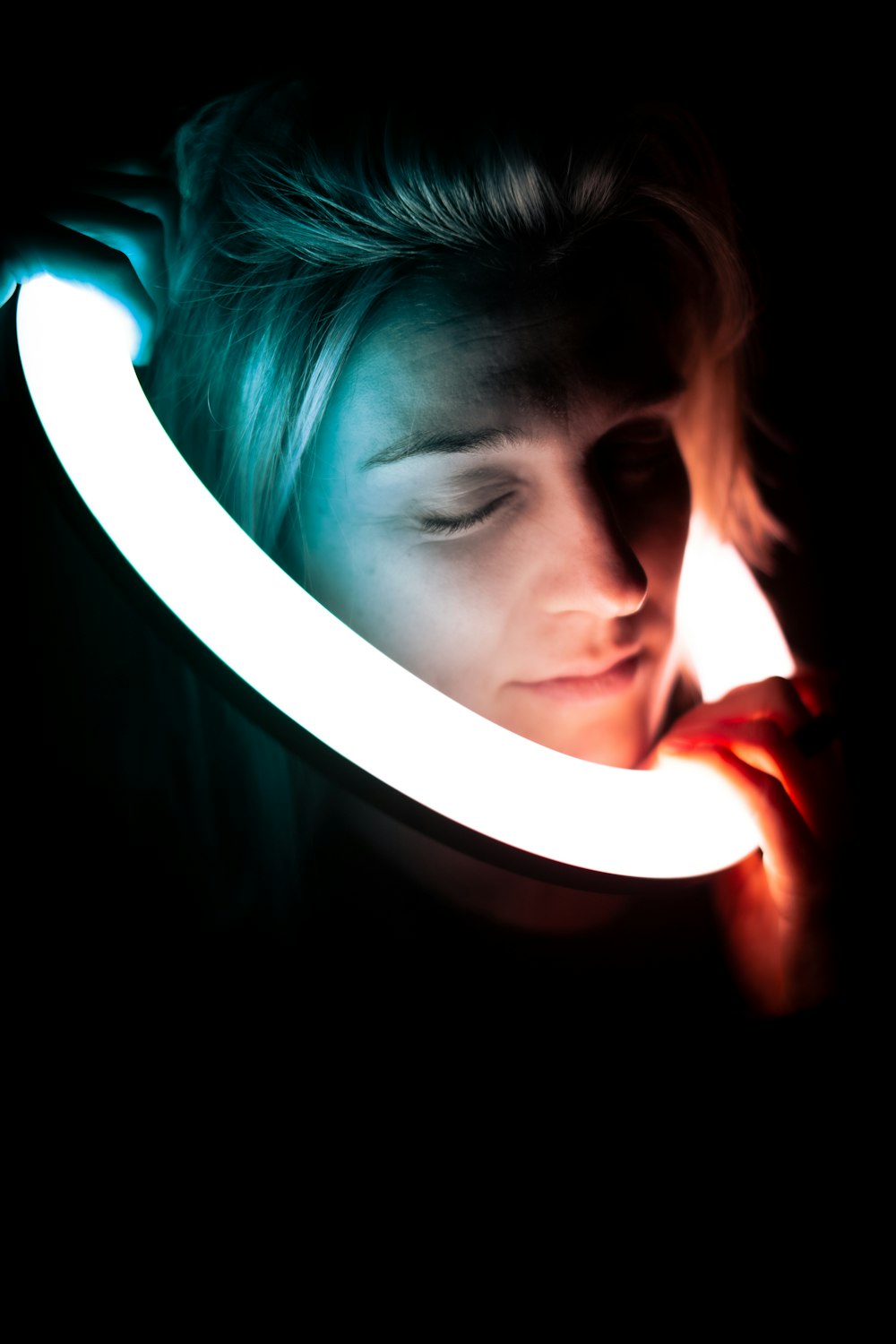 a woman holding a lit up light in her hand