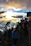 A group of hikers enjoying a sunrise view over Machu Picchu terraces.