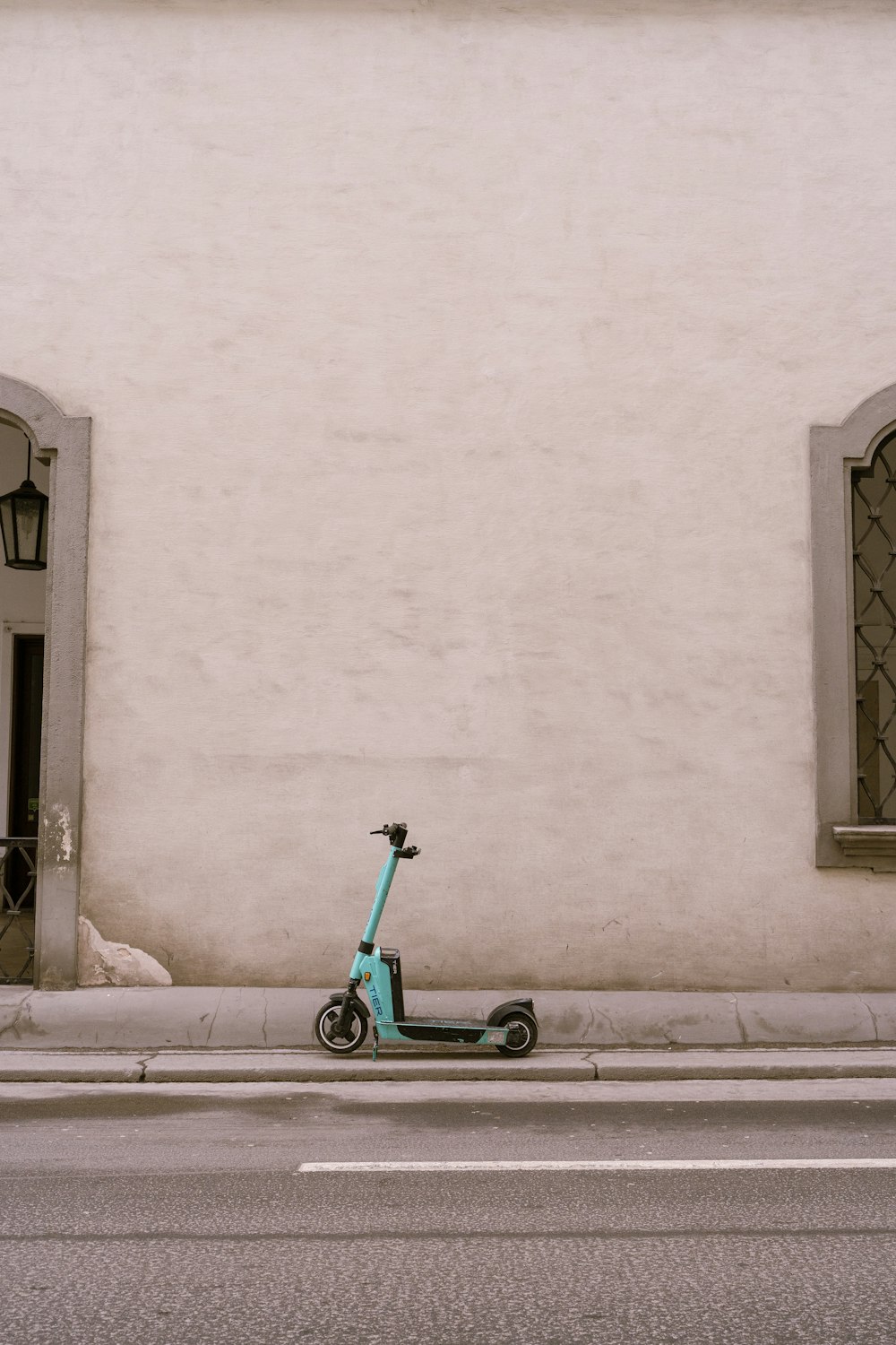 a scooter parked on the side of the road