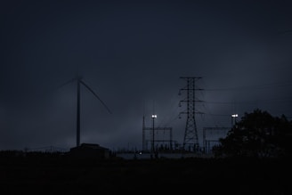 a group of power lines in the dark