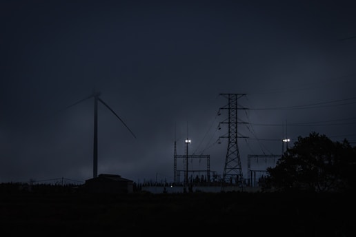 a group of power lines in the dark