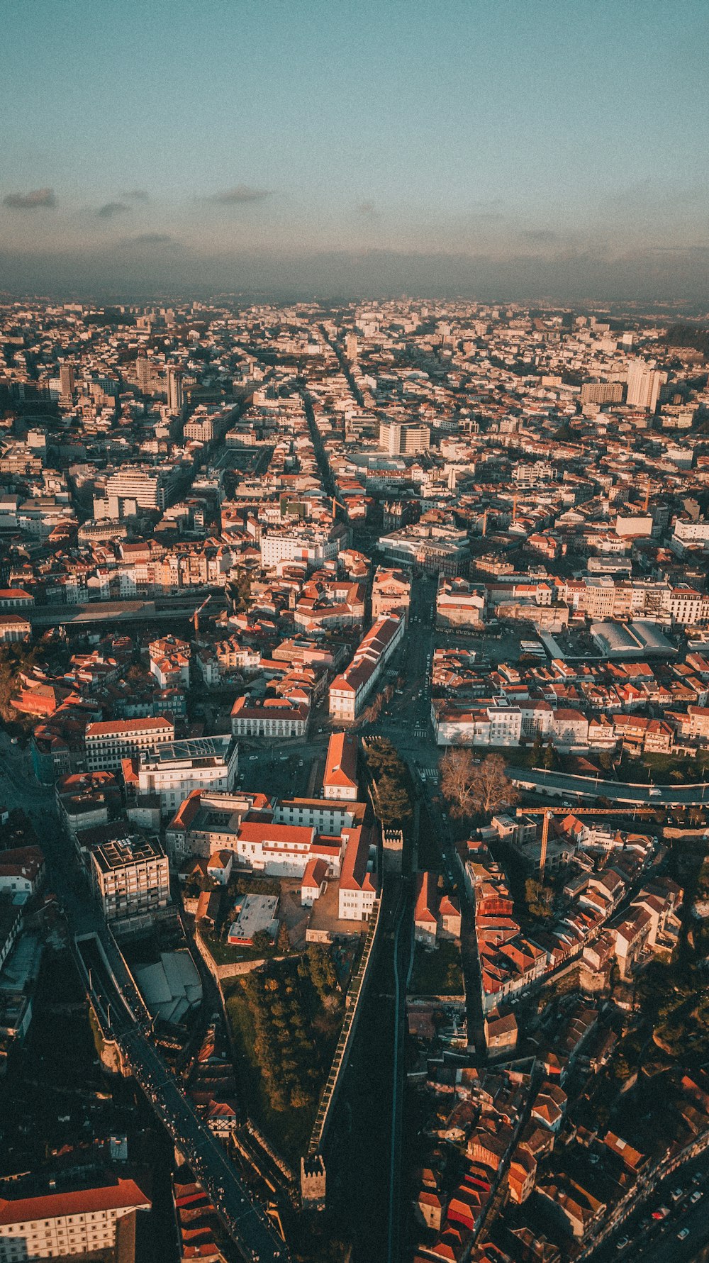 an aerial view of a city with lots of tall buildings