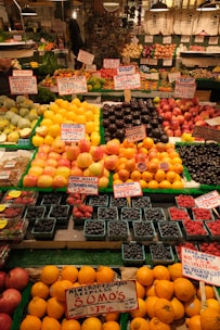 a display in a grocery store filled with lots of fruits