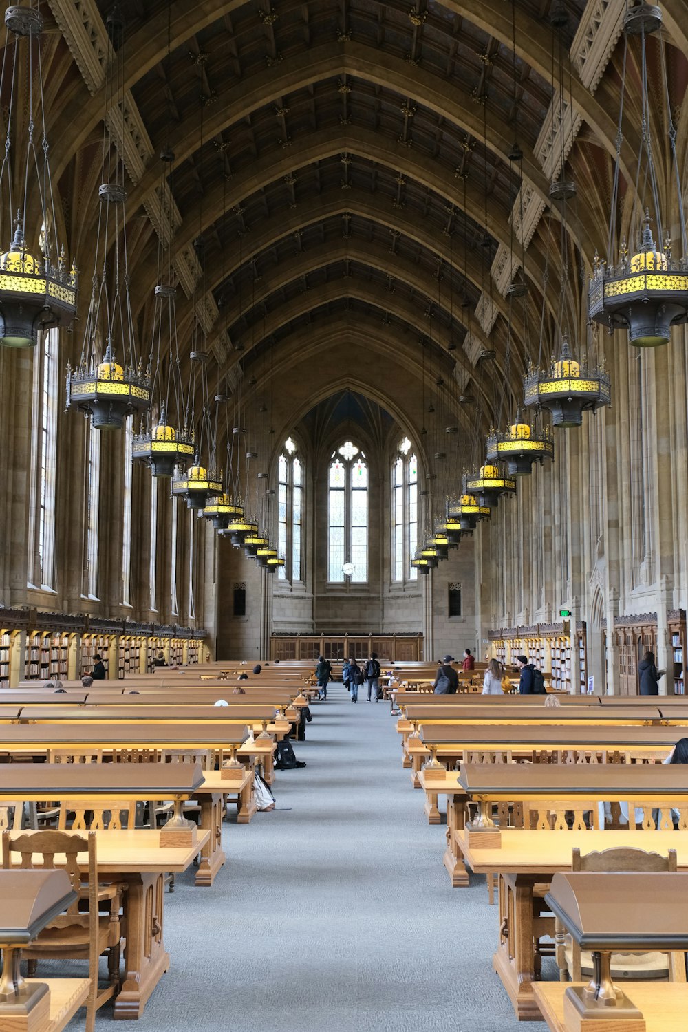 a large room filled with lots of wooden benches