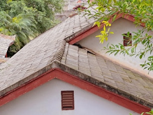 the roof of a house with a bird perched on top of it