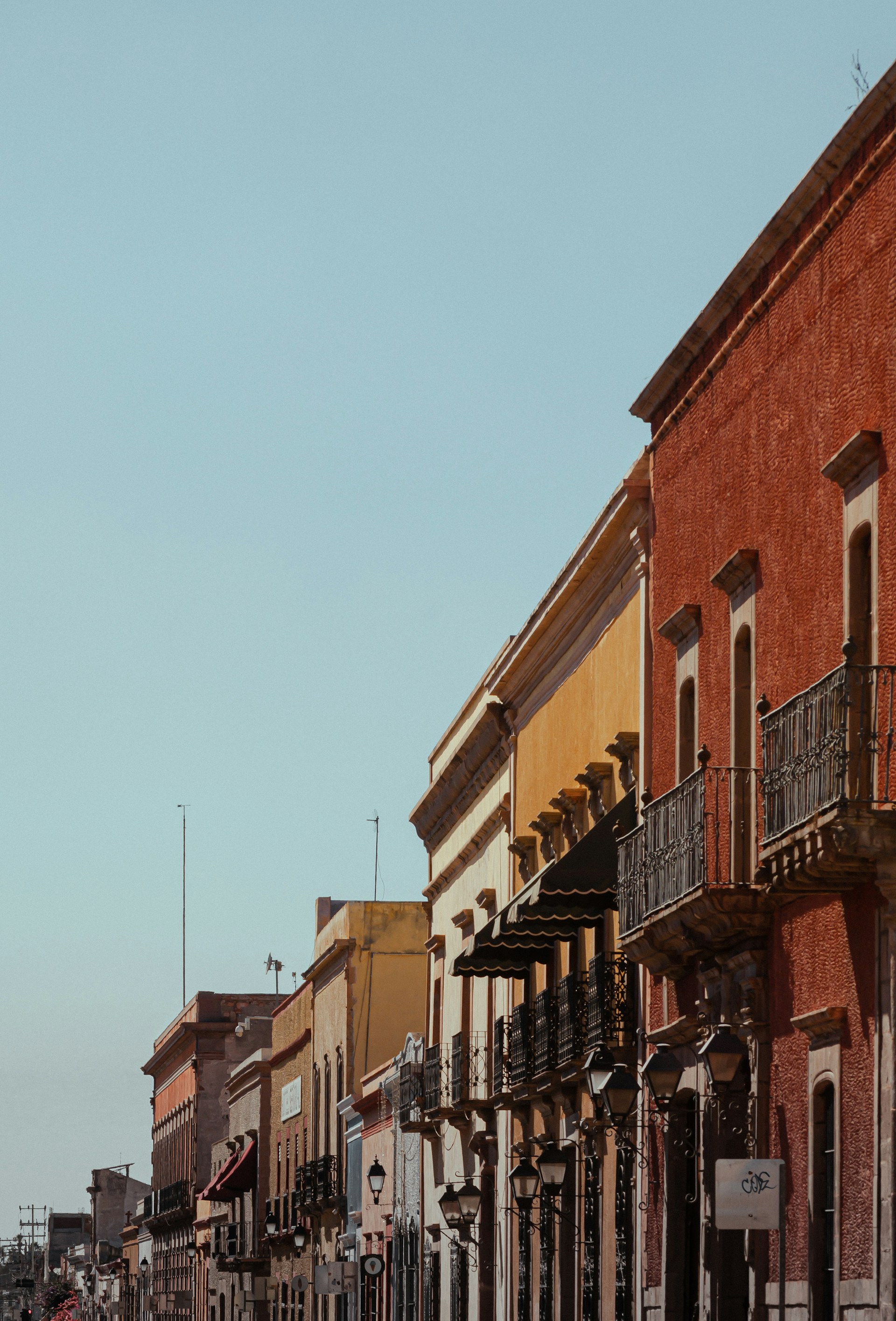 a row of buildings on a city street