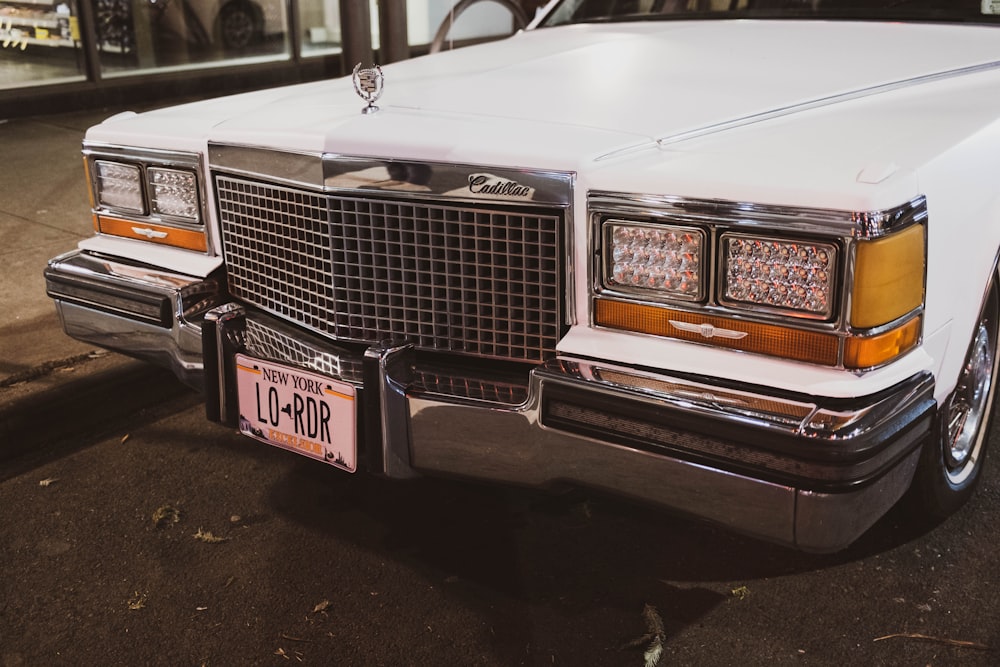 a white car parked on the side of the road