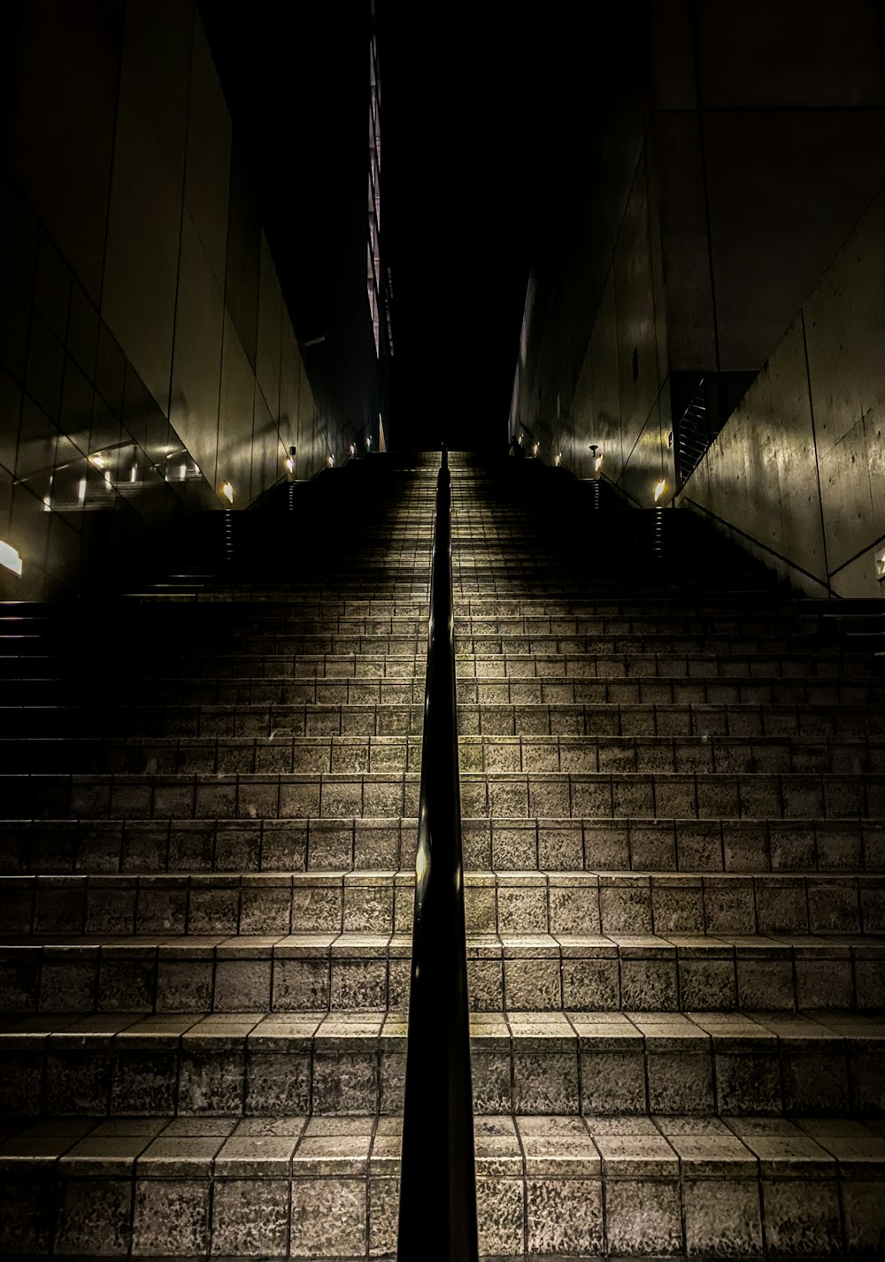 a stairway with steps lit up at night
