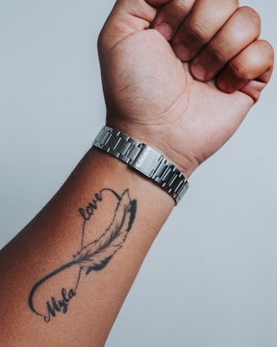 a woman's arm with a tattoo on it