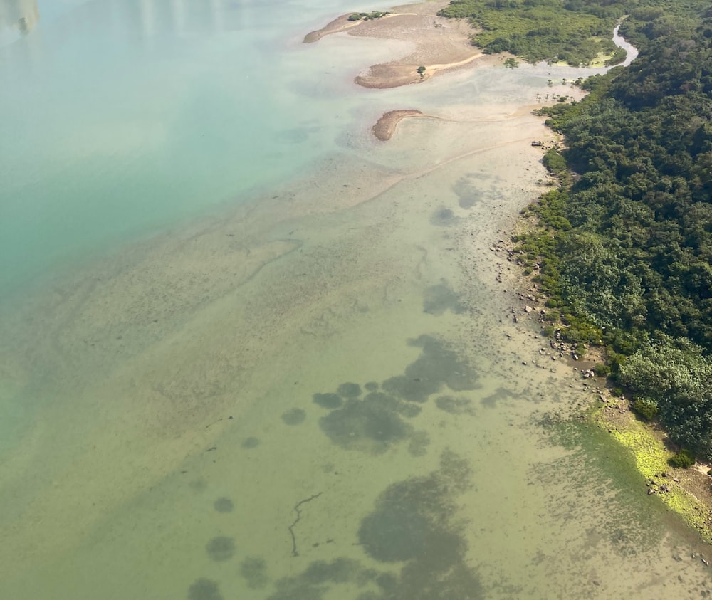 an aerial view of a body of water and land