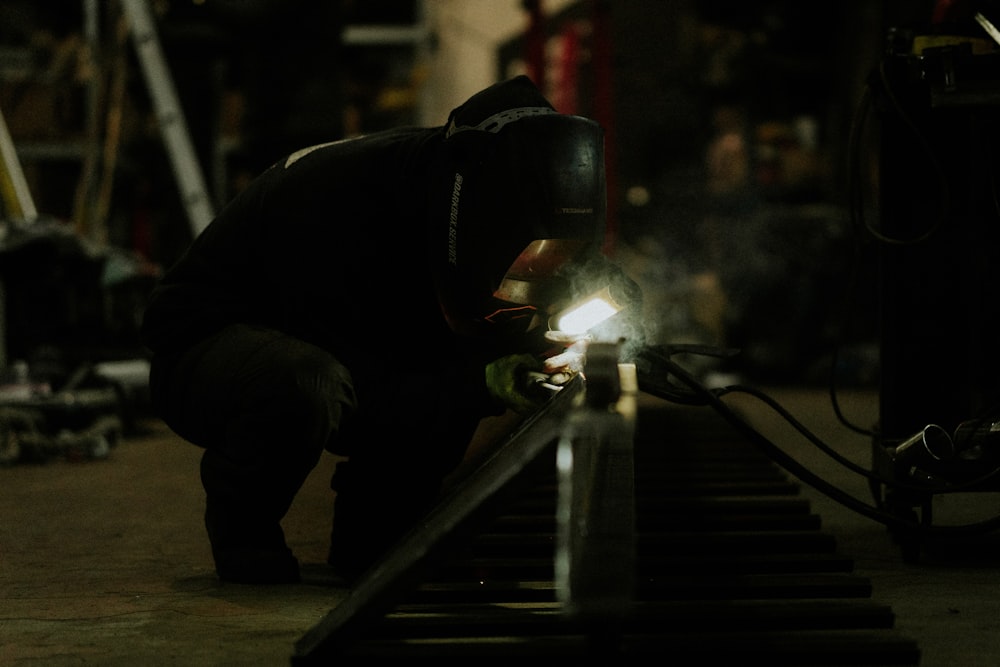 a man working on a piece of metal