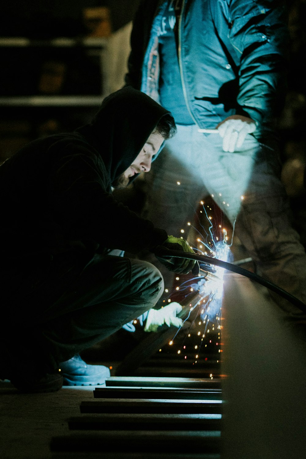 a man working on a piece of metal