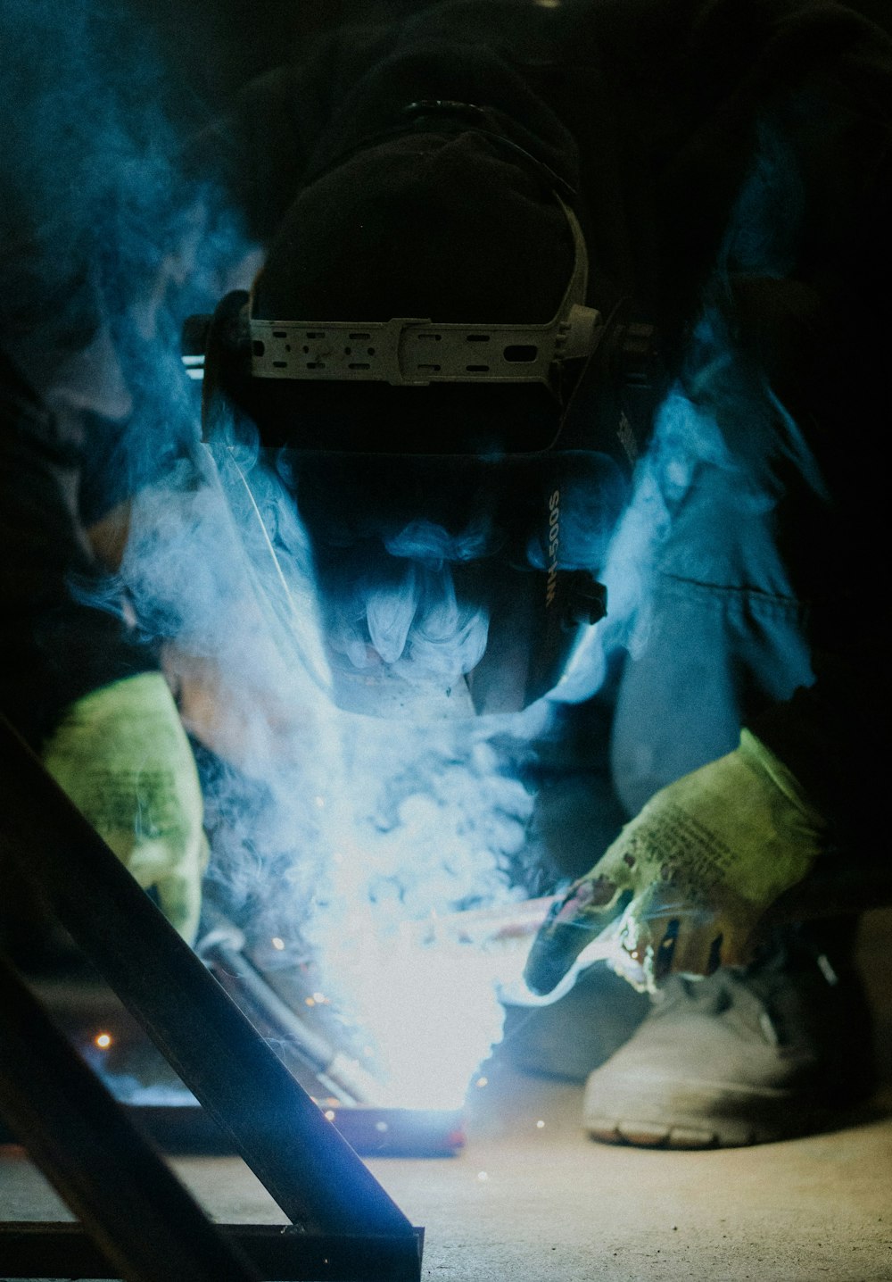 a welder working on a piece of metal