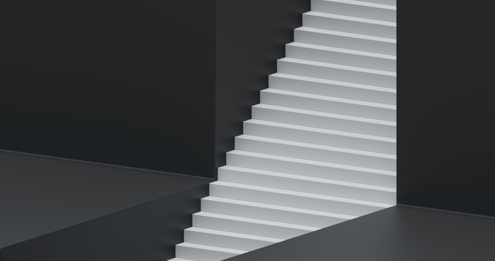 a white staircase in a black room
