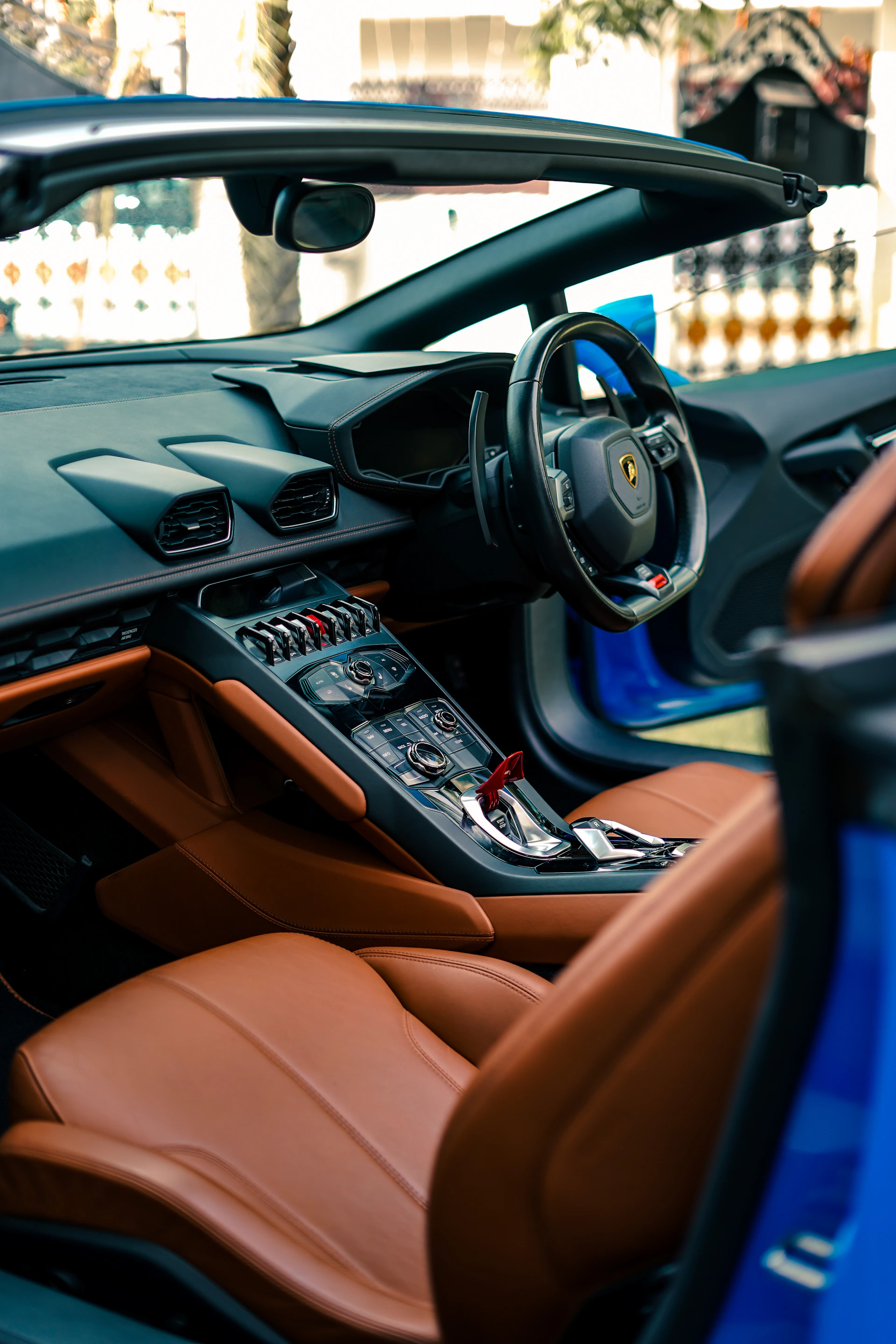 the interior of a sports car with leather seats