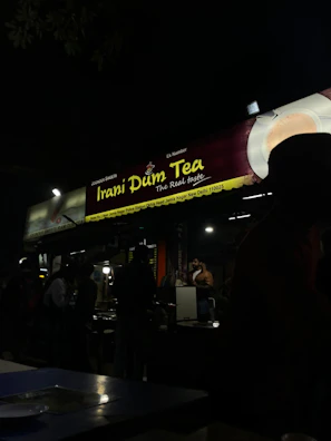 A vibrant stall at the chai mahotsav serving steaming kulhads of masala chai to smiling visitors.