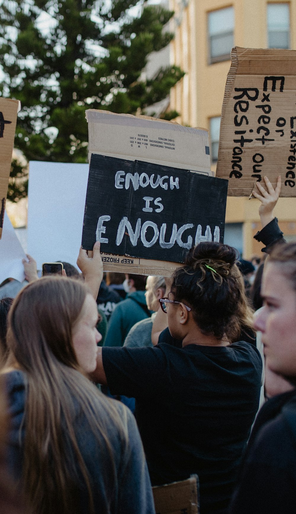 a group of people holding up signs in the air