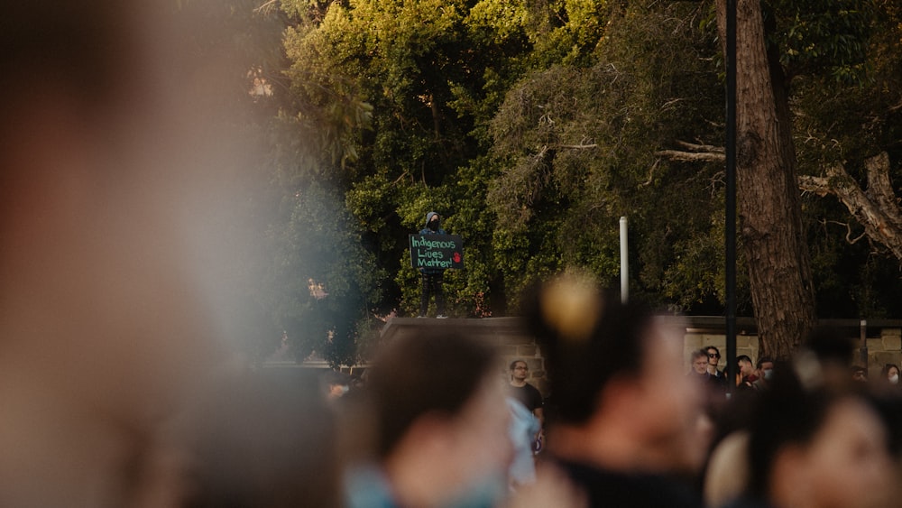 a crowd of people walking down a street