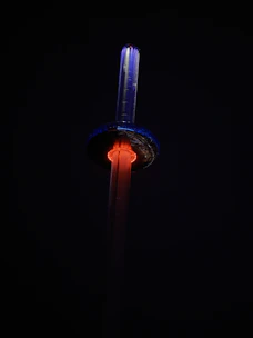 A sleek, futuristic celestial tower glowing softly under a starry night sky.