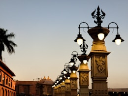 a row of street lamps on a city street