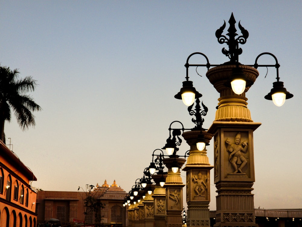 a row of street lamps on a city street