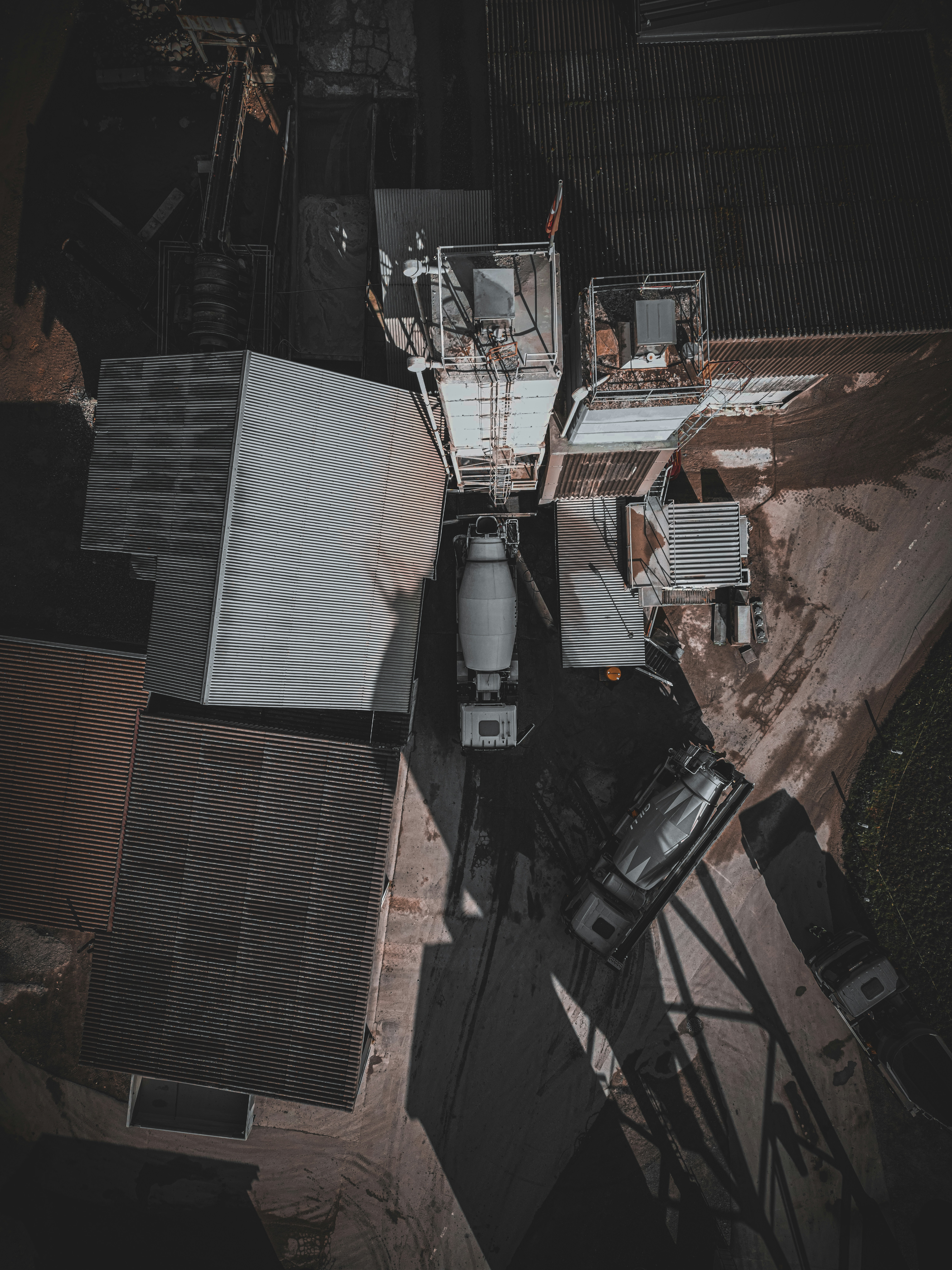 an aerial view of a building with a truck parked in front of it