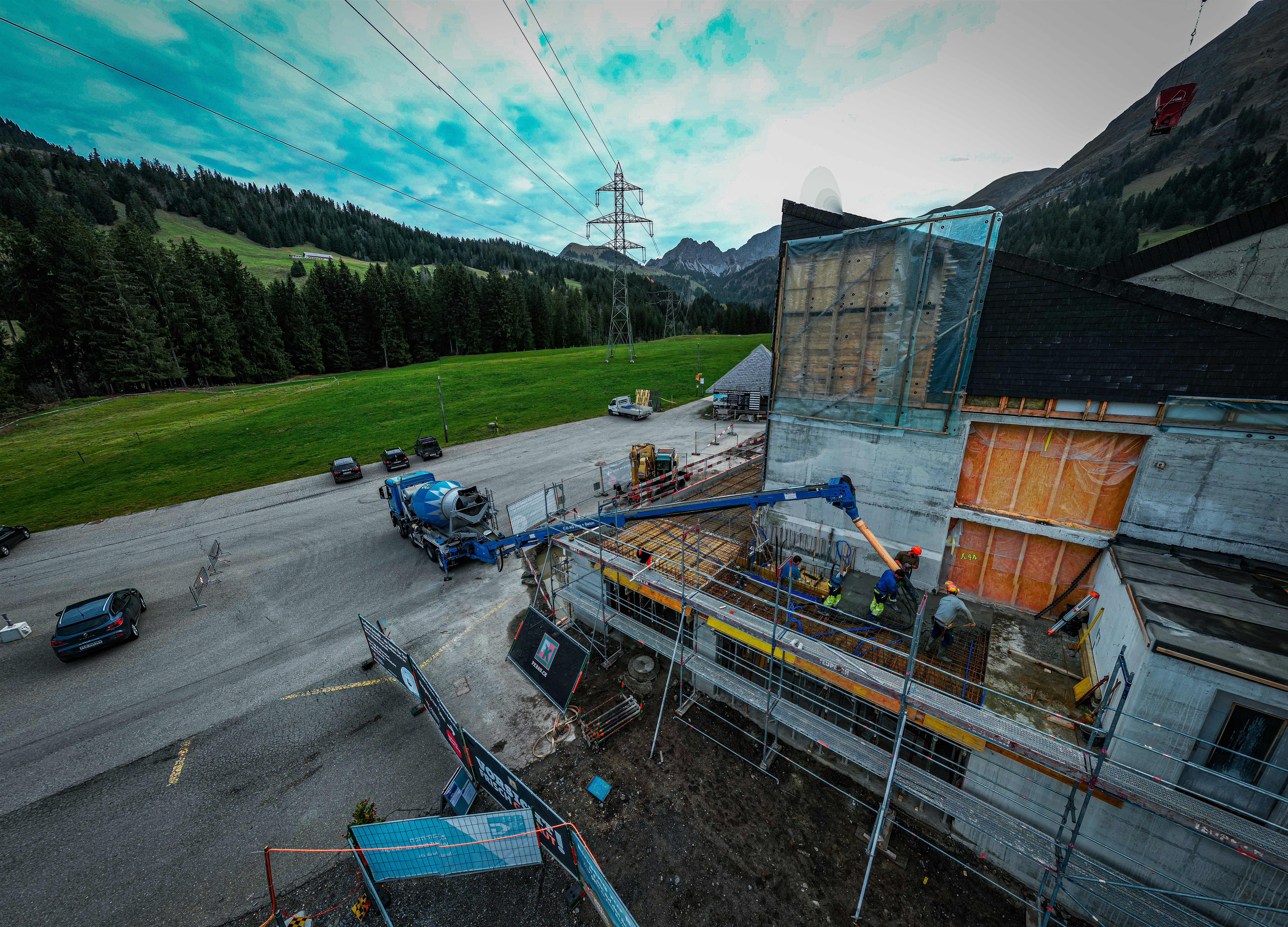 a building being built with a crane on top of it
