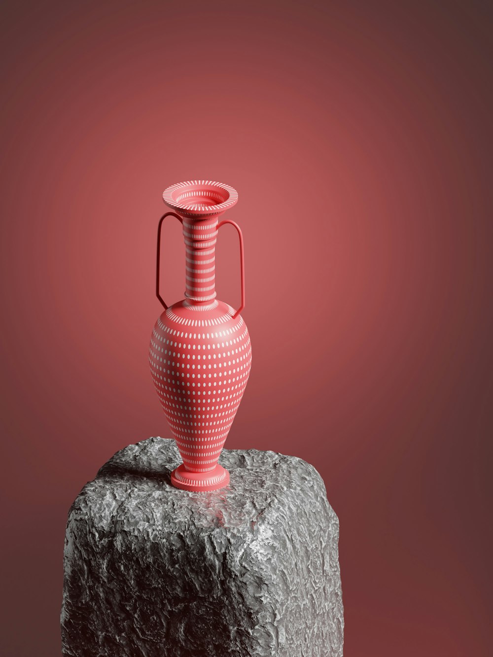 a red vase sitting on top of a rock