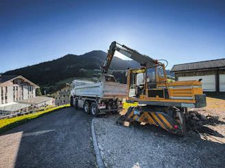 a construction truck is parked on the side of the road