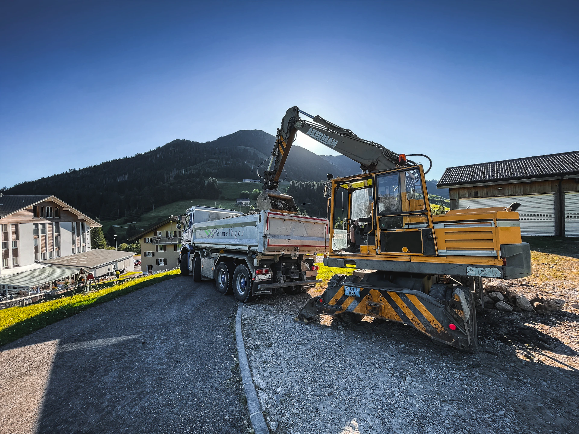 a construction truck is parked on the side of the road