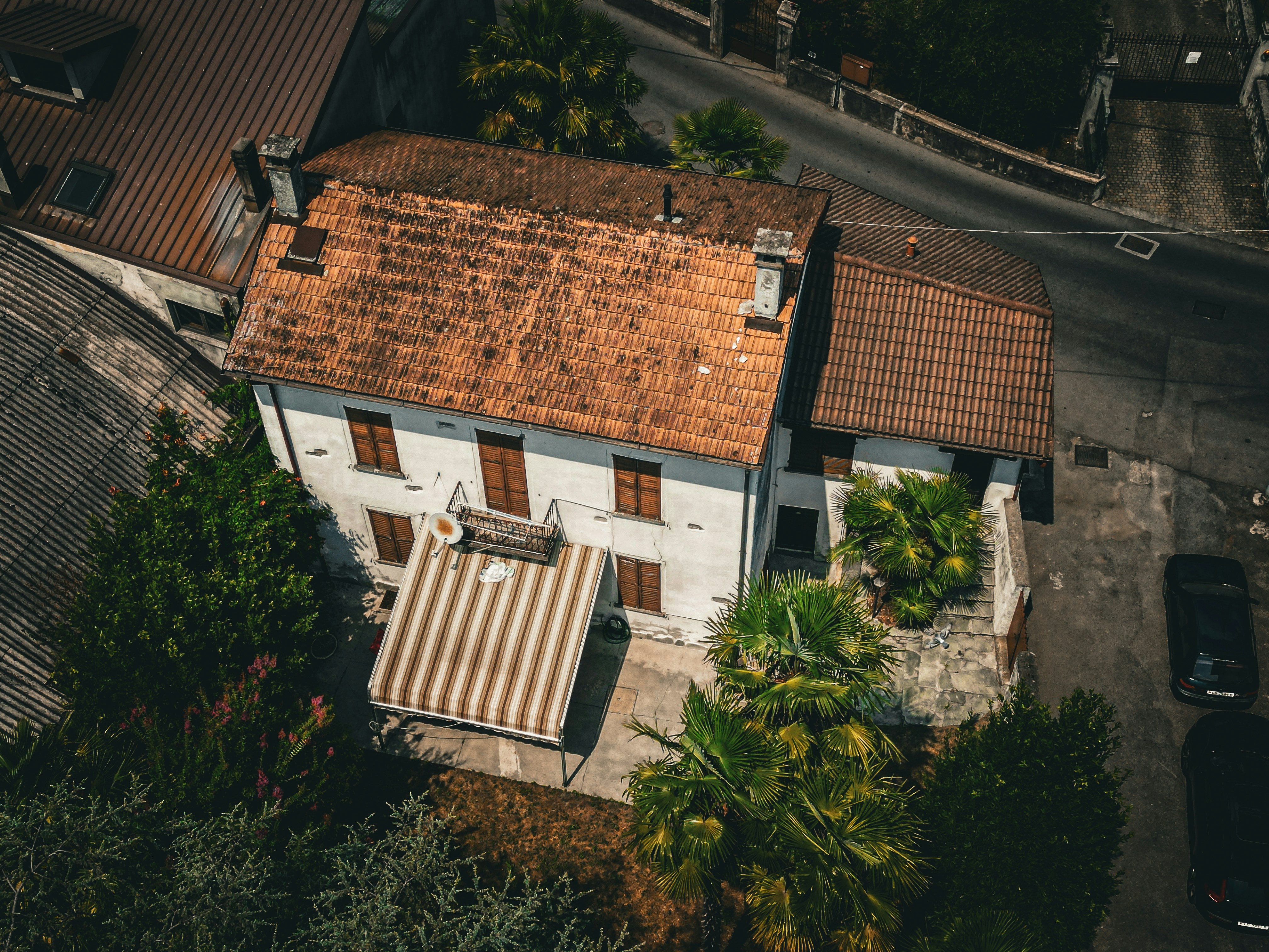 an aerial view of a house with a tiled roof