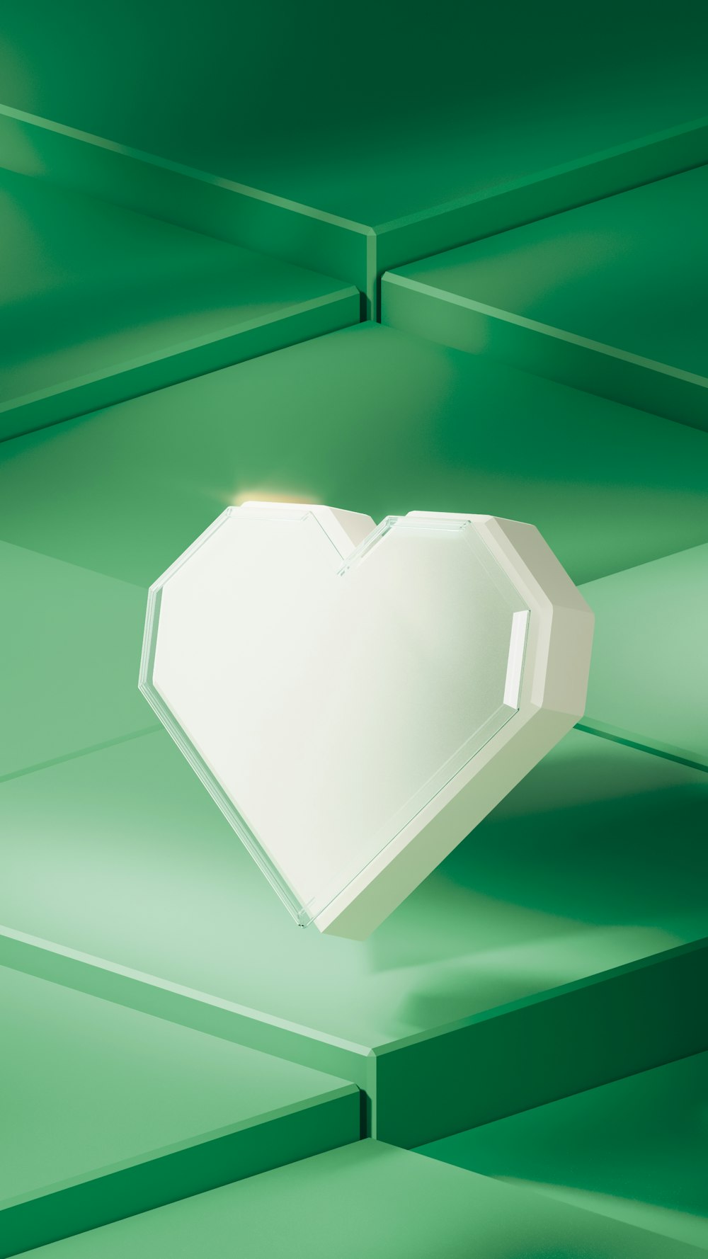 a white heart shaped object on a green background